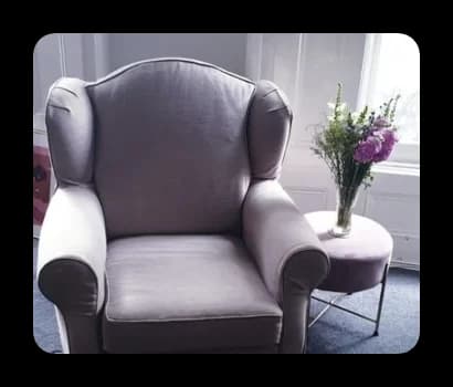 a free upholstered preloved mauve armchair that was found